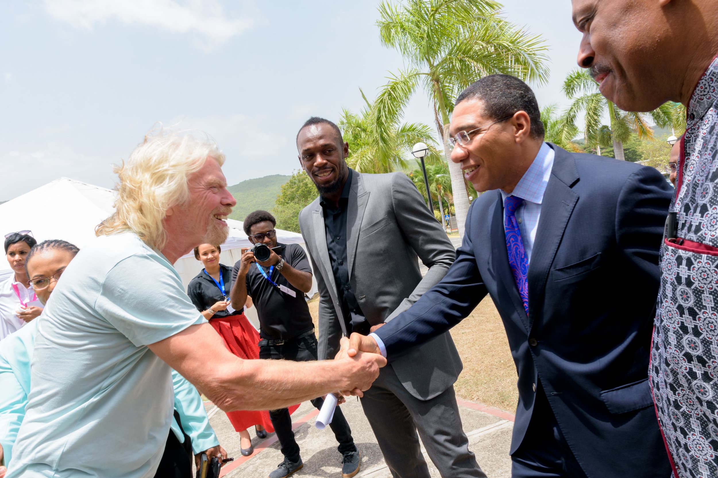 Richard Branson and Andrew Holness on stage