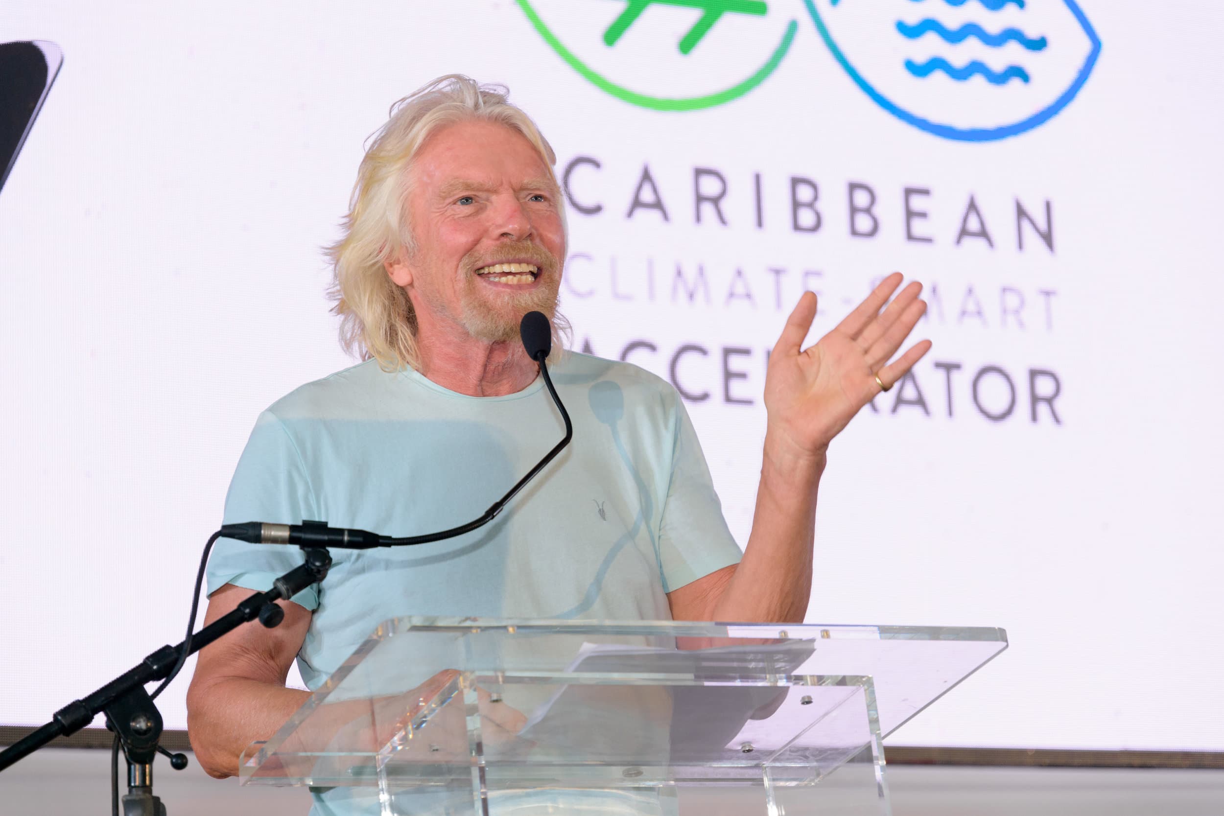 Richard Branson removing Andrew Holness’s tie